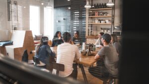 A business team have a meeting to discuss their needs